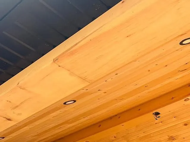 Wood porch ceiling and soffit with recessed lights.